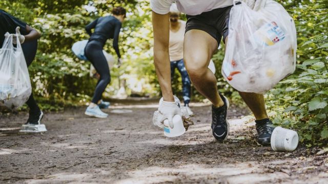 Joggers picking up litter aka 